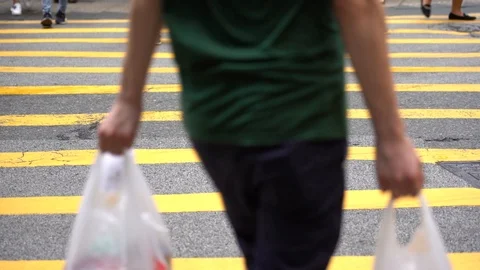 Slow motion of Pedestrians walking over the street in Hong Kong Stock Footage 124988367