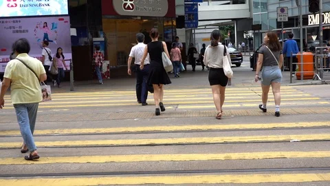 Slow motion of Pedestrians walking over the street in Hong Kong Stock-Footage 124988417