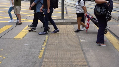 Slow motion of Pedestrians walking over the street in Hong Kong Video stock 124988440