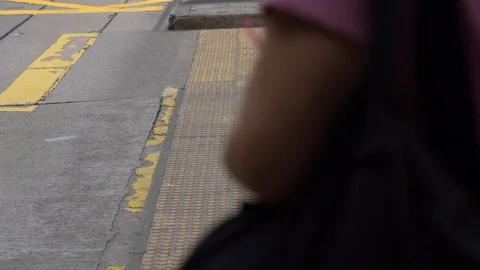 Slow motion of Pedestrians walking over the street in Hong Kong Stock Footage 124988447