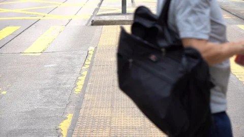Slow motion of Pedestrians walking over the street in Hong Kong Stock Footage 124988460