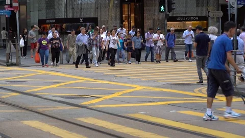 Slow motion of Pedestrians walking over the street in Hong Kong Stock Footage 124988463