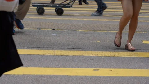Slow motion of Pedestrians walking over the street in Hong Kong Video stock 124988472