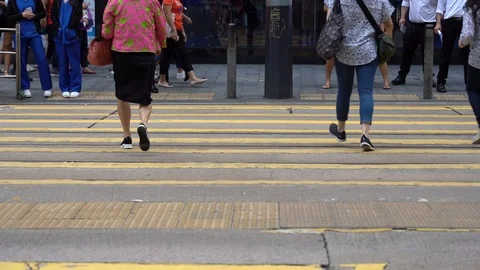 Slow motion of Pedestrians walking over the street in Hong Kong Stock Footage 124988499