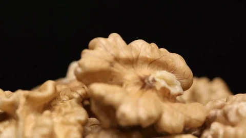 SLOW MOTION: Peeled walnut nuts fall on a heap Vídeos de archivo 71569156