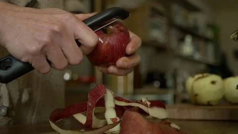 Slow motion peeling apple Stock Footage 70987306