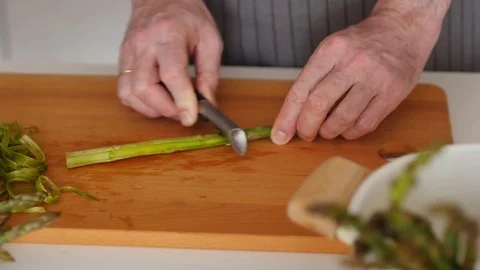 Slow motion of peeling asparagus Stock Footage 76254366