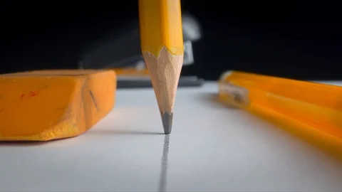 Slow motion of a pencil on a table Stock Footage 125248929