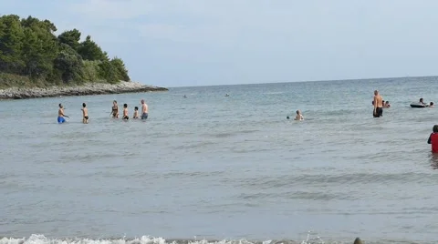 Slow Motion- People on Beach Playing Stock Footage 53873886