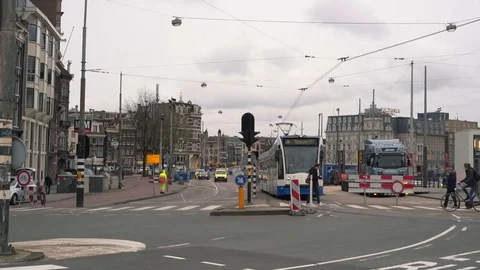 Slow motion of people cross empty street of Amsterdam, coronavirus Covid-19 Stock Footage 126750101