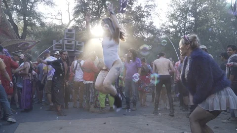 Slow motion of people dancing and jumping rope at yoga music festival, Oregon Stock Footage 122470890