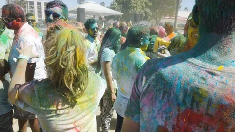 Slow motion of people dancing and jumping, color holi festival Stock Footage 135316535