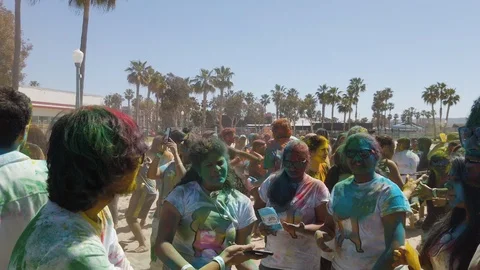 Slow motion of people dancing covered in colors, color holi festival Stock Footage 135315151