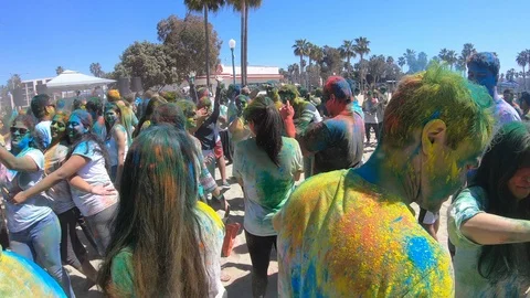Slow motion of people drinking and having fun, color holi festival Stock Footage 135317334