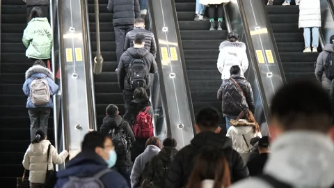 Slow motion people in the elevator in metro station busy rush hour Stock Footage 168691732