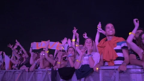 Slow motion of people having fun at a music festival Stock Footage 107449801