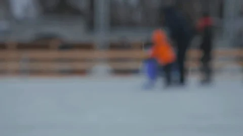 Slow motion: People ice skating. Ice skating rink. Defocused Stock Footage 100365074