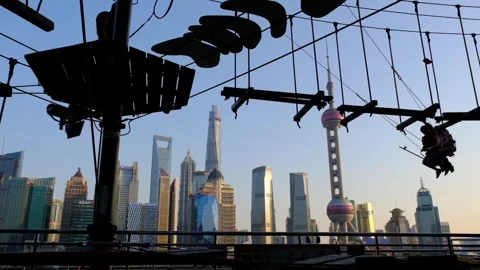 Slow Motion of people playing on the swing in China's Shanghai Stock Footage 301983302
