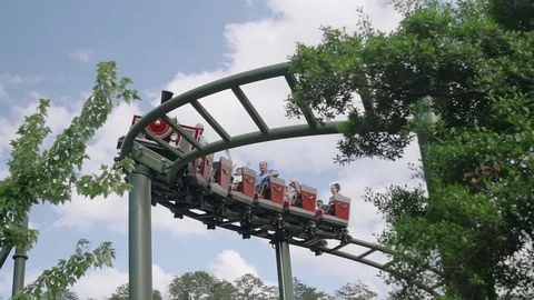 SLOW MOTION: People riding the roller coaster 4k Stock Footage 76507274