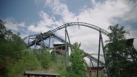 SLOW MOTION: People riding the roller coaster 4k Stock Footage 76509114