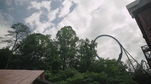 SLOW MOTION: People riding the roller coaster 4k Stock-Footage 76513905