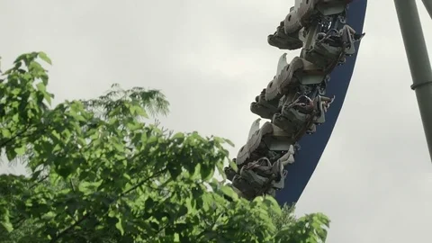 SLOW MOTION: People riding the roller coaster 4k Stock Footage 76519135