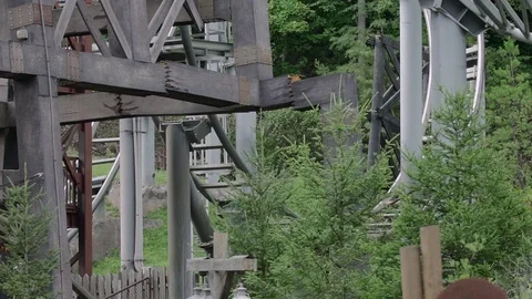 SLOW MOTION: People riding the roller coaster 4k Stock Footage 76534874