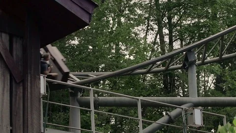 SLOW MOTION: People riding the roller coaster 4k Stock Footage 76550756