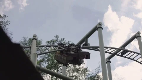 SLOW MOTION: People riding the roller coaster 4k Stock Footage 76553229