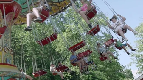 SLOW MOTION: People riding the roller coaster 4k Stock Footage 76586705