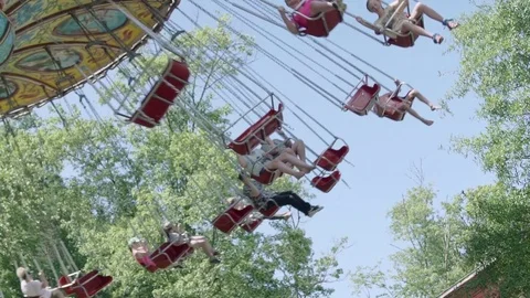 SLOW MOTION: People riding the roller coaster 4k Stock Footage 76590290