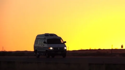 SLOW MOTION: People on road trip camping holidays traveling by RV car at dawn Stock Footage