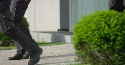 Slow Motion Of People In Uniforms Walking Out Of Building Stock Footage 145476703