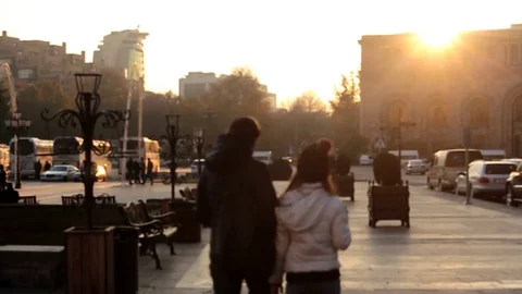 Slow Motion. People walking on the background sunset in the city Vidéo 83551194