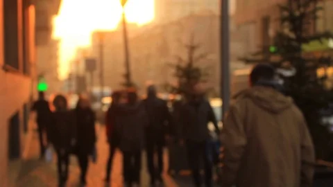Slow Motion. People walking on the background golden sunset in the city Stock Footage 84741994
