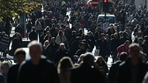 Slow motion of people walking on Buchanan Street in Glasgow Stock Footage