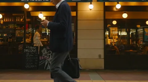 Slow motion of people walking in front of french cafe Stock Footage 67977826