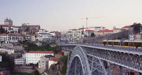 Slow motion of people walking on side of bridge while trains go back and forth Stock Footage 155254881