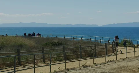Slow motion of people walking the trail at Rancho Palos Verde, California Stock Footage 99153115