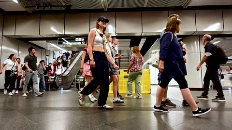 Slow motion of people walking in the train station. People on escalator Stock Footage 253221506