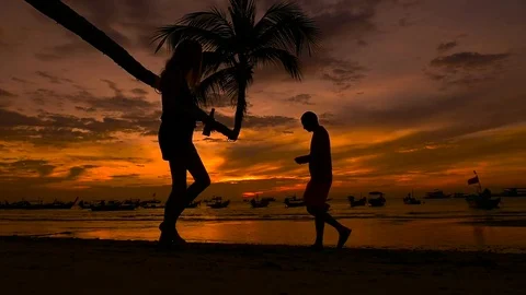 Slow Motion People walking on tropical beach at sunset. Koh Tao island Stock Footage 74642749