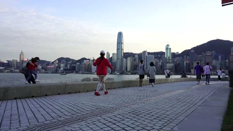 Slow motion of people in West Kowloon Waterfront Promenade Stock Footage 166183653