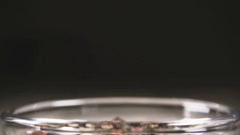 Slow motion pepper mixture pour peas into a bowl close-up Stock Footage 95793228