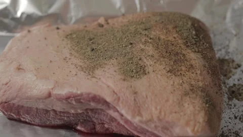 Slow motion pepper sprinkled on brisket close up Stock Footage 249290457