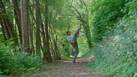 Slow motion. A person diligently practices various martial arts techniques while Stock Footage 312475924