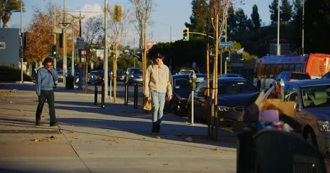 Slow motion of a person walking by in Los Angeles, California Stock Footage 115920117