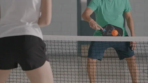 Slow motion pickleball rally two athletes Stock Footage 299423699