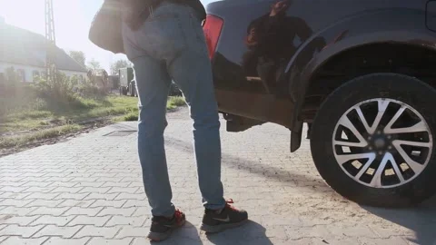 Slow motion pickup moves backwards and parks in the morning, man shows when 스톡 동영상 202069337