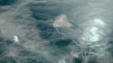 Slow motion. A piece of ice breaks on the ice of Lake Baikal Stock Footage 170760671