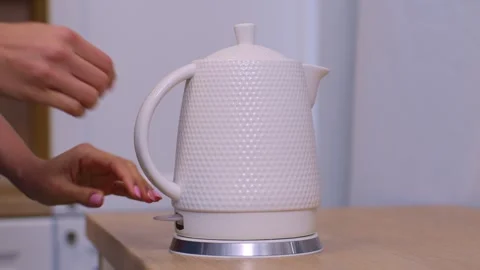 Slow motion plan to put the kettle on for morning tea or coffee and turn it on Vidéo 263183885